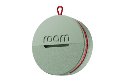 Round green device with 'roam' branding on a white background