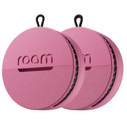 Pink circular device with 'roam' branding on a white background