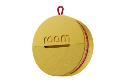 Yellow circular device with 'room' branding on a white background