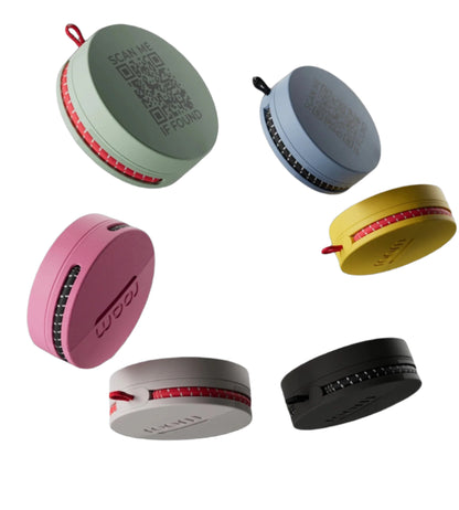 Roam smart tracker collection showing 5 units in multiple colors - green, blue, pink, yellow, grey and black with QR codes and 'roam' branding on white background